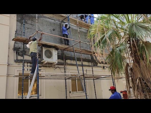 Plaster on wall by machine