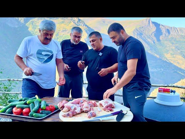 Cooking a national Dagestan dish in a cauldron over a fire