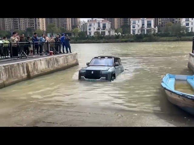 BYD Yangwang U8 crossing a rushing river, showcasing its water-driving performance