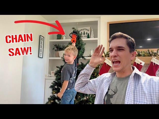 HE took a Chainsaw to our Christmas tree! Our tree is Ruined!