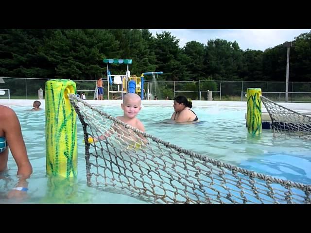 3yo William going down the tongue slide at the local pool