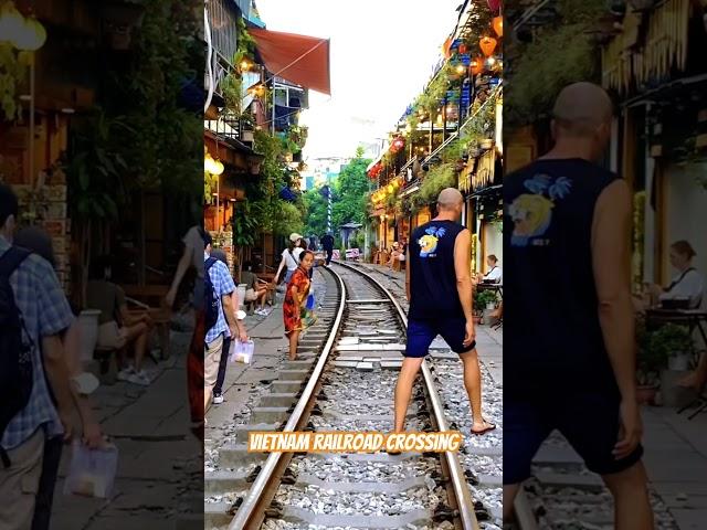Vietnam railroad crossing : Hanoi train street. Vietnam railway market. cà phê đường tàu Hà Nội.