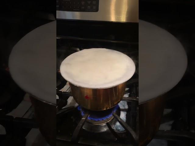 Milk boiling in new vessel during house warming.