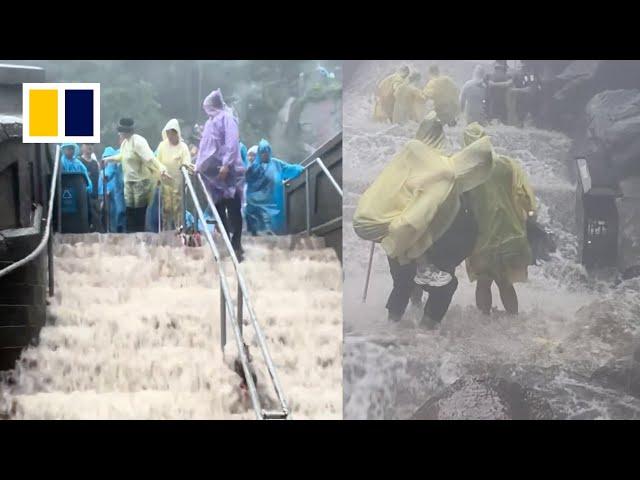 Visitors evacuated as heavy rain batters Chinese mountain