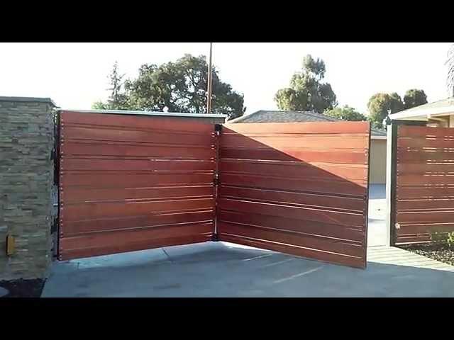 Trackless bi fold automatic gate 14'