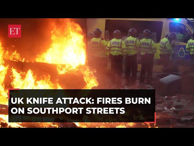 UK knife attack: Fires burn on Southport streets as anti-Muslim protesters clash with police