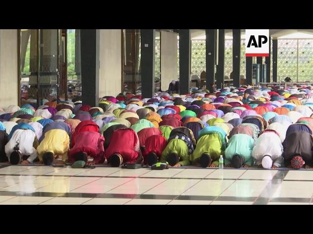 Muslims in Malaysia mark Eid with prayers