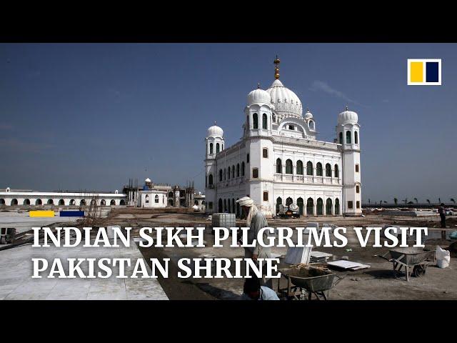 Indian Sikhs pilgrims cross border into Pakistan to visit holy site