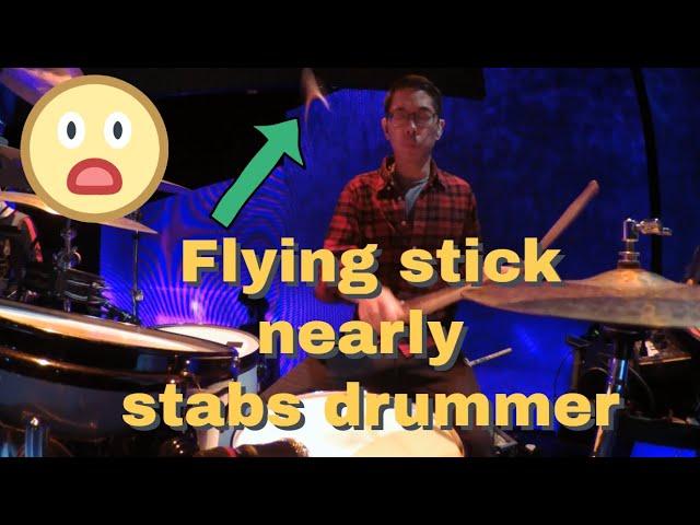 Flying stick nearly stabs drummer!