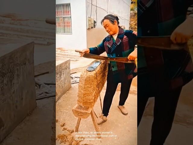 Carving a wooden chair-uses a large chisel-like tool to shape the wood