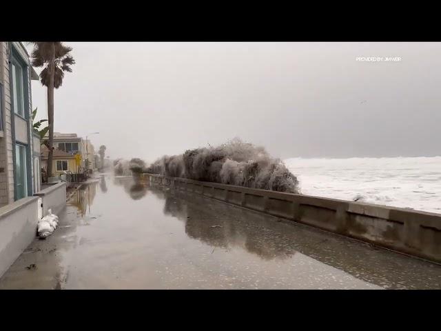 Giant waves crash over Mission Beach Boardwalk