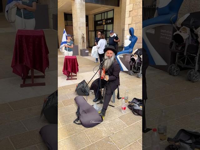 Orthodox Jew plays the guitar during Jerusalem Day celebrations. Israel 2025