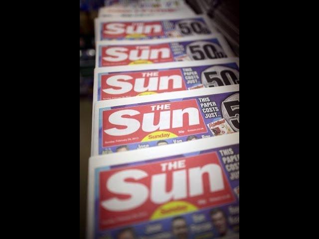 Headline: Reporters of Britain's Sun, Daily Mirror charged with bribery