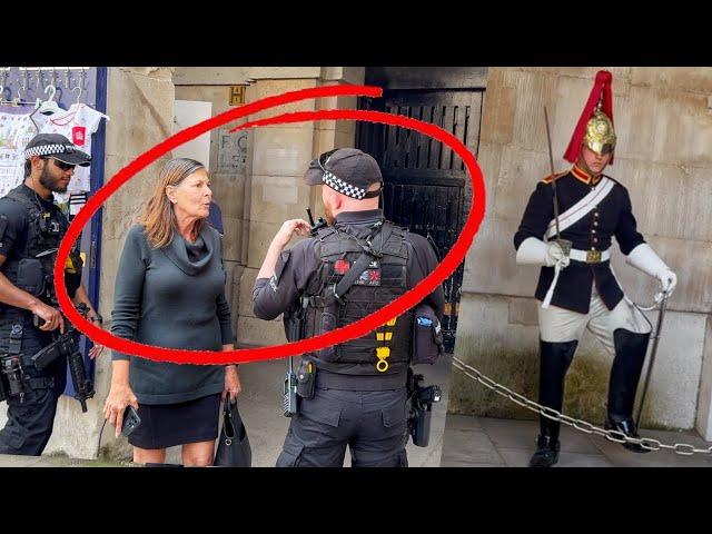 Armed Officers Confronts a Lady for Wandering into King's Guards Restricted Area