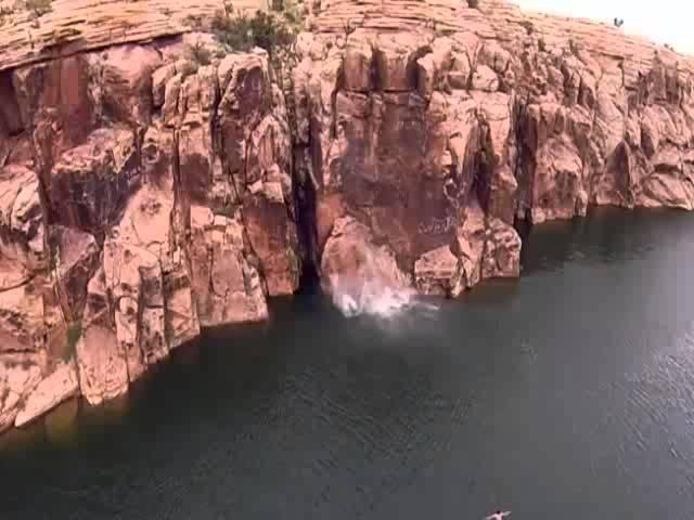 Cliff jumping fail  Rock gives way...