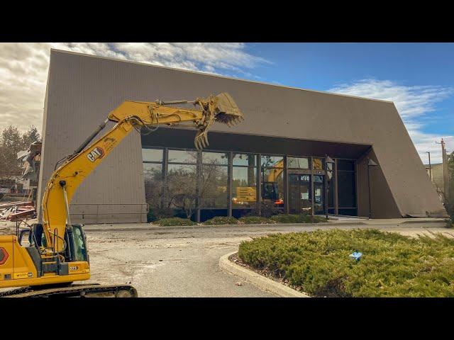 Demolishing a Huge Bank with a Caterpillar Excavator