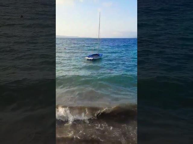 Wayfarer dinghy on waves