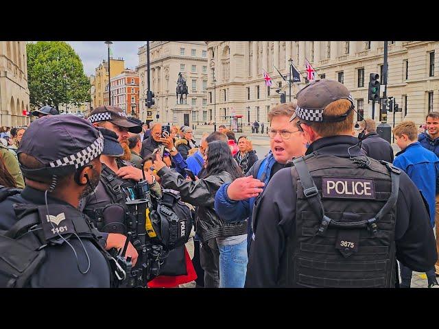 POLICE REMOVE RACIST INVESTIGATOR IDIOT WHO SUGGESTS THROWING THINGS at Horse Guards!