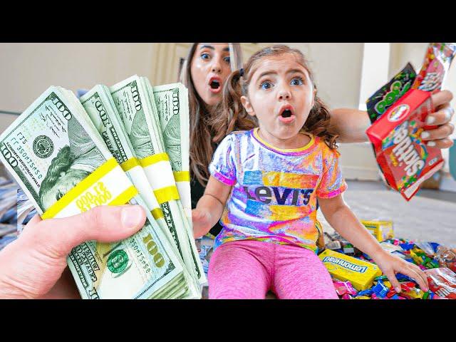 3 Year old Picks Between Money & Candy!