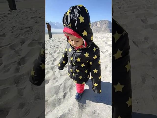 little baby trying to walk on cold desert skardu