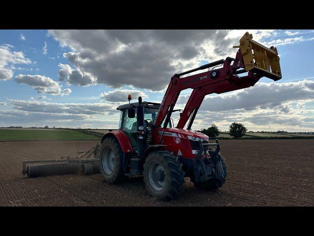 Tractors and diggers. Drilling new grass