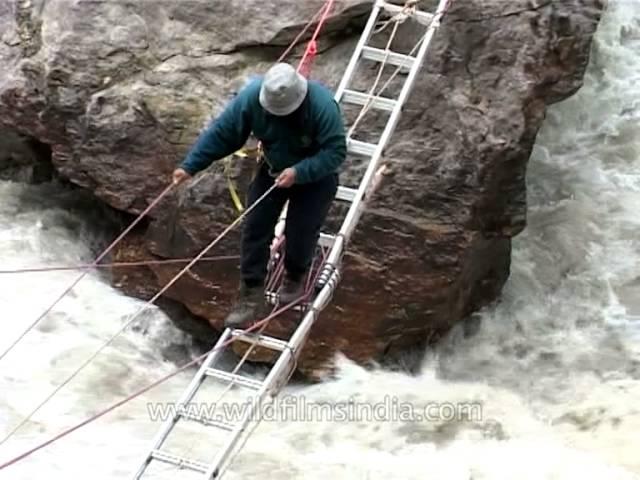 Harish Kapadia crossing the Rishi Ganga river en route Nanda Devi