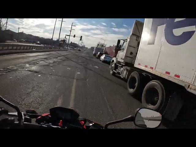 Biker gets cut off by fedex truck