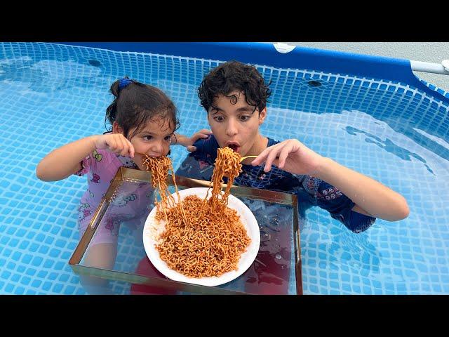 Children eat in the pool