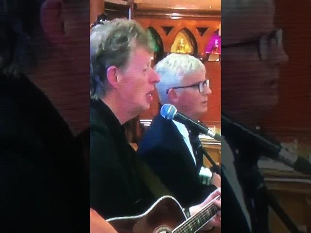 RUNRIG LEADERS CALUM & RORY AT THE BRUCE GUTHRO FUNERAL. THEY PERFORM AT THE END.