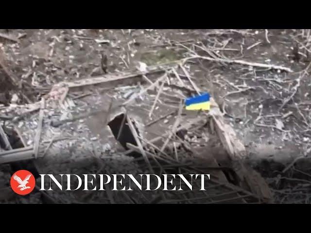 Ukraine flag flies on building after village of Robotyne captured from Russia