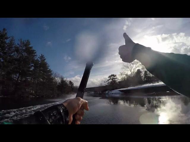 Snowmobile skimming while towing waterskier and barefooter