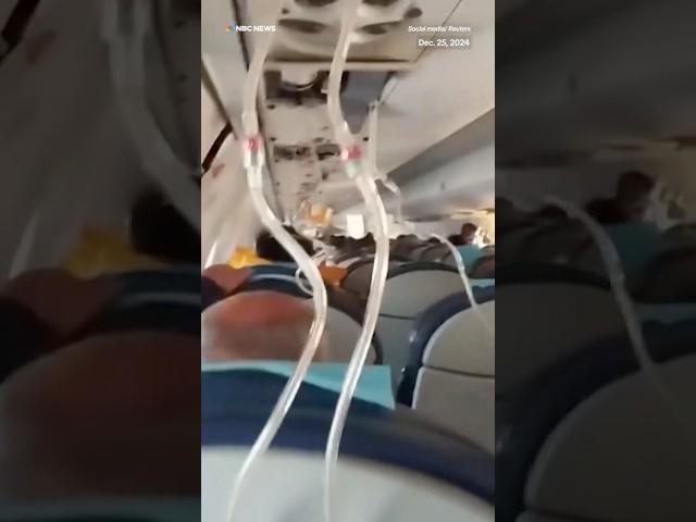 Passengers on an Azerbaijan Airlines were seen wearing masks in the cabin before the plane crashed.