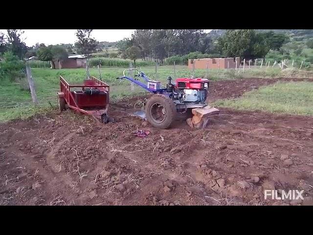 ploughing with the two wheel tractor.