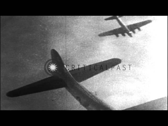 A burning American B-17 aircraft falls through clouds in Germany. HD Stock Footage