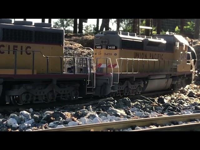 Two Dash 9s Assist 2 Six Axle Gensets Pull Heavy Freight Over My G Scale Mountain Sub!