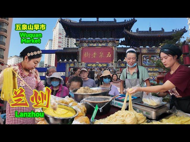 The bustling Wukui Mountain morning market, embodying the local warmth and the vibrant atmosphere of