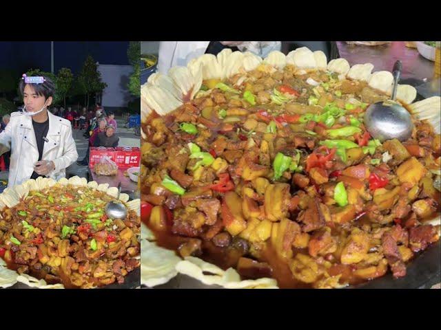 A Chinese Guy Cook Free Meals / Pork Potato Meat Noodles Food for the old on the Street in a Village