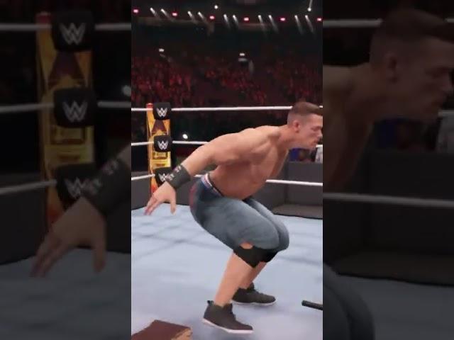 John Cena takes Randy Orton through a table with an Attitude Adjustment