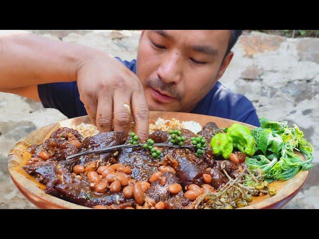 eating mithun skin and kidney beans, bitter egg plant, litsea ccubeba, chayote leaves, king chilly.