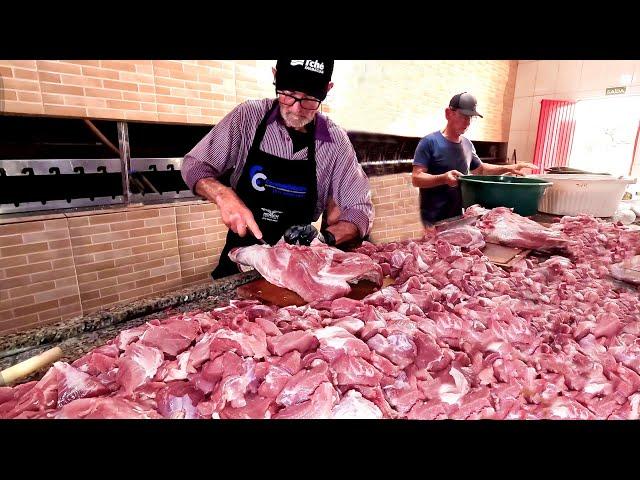 Brazilian feast of pork cracklings, skewered loin and shank, sausage and smoked steak