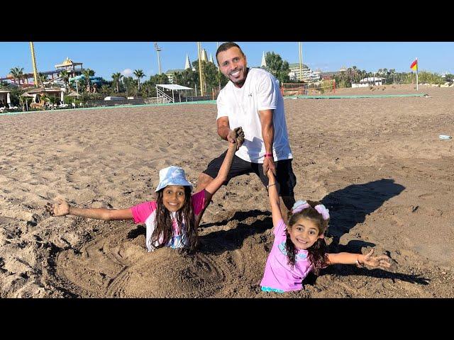 My Daughters Deema and Sally play stuck in the sand rescue Adventure