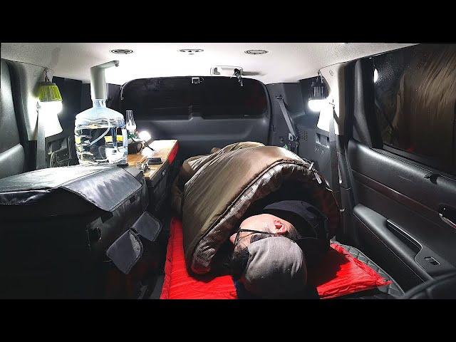 Man eating and sleeping in car - SUV stealth car camping