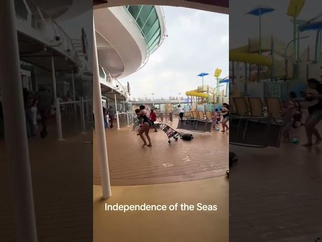 Royal Caribbean cruise ship passengers run for cover as storm batters deck furniture