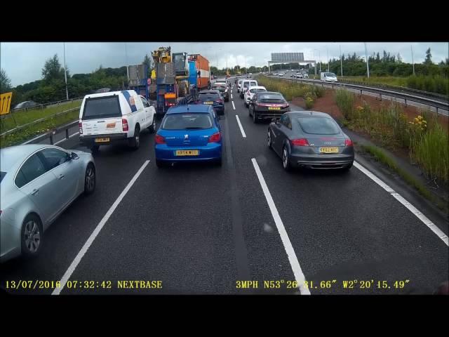 Truck driver gets out on the motorway in live traffic