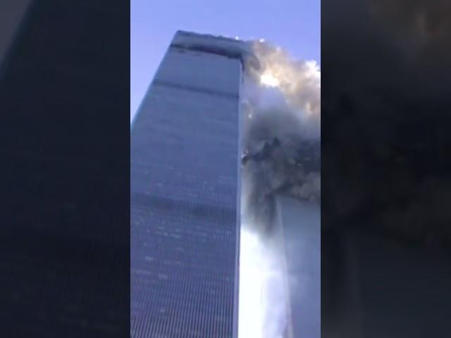 Reporter on camera as tower begins to collapse