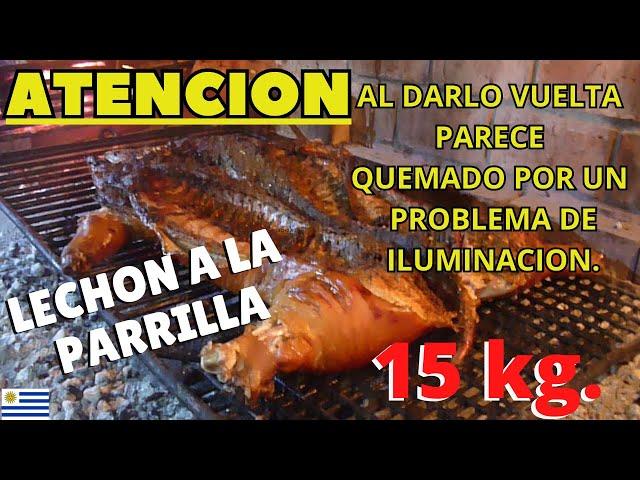 LECHON ENTERO A LA PARRILLA. "CONTIENE UNA PARTE MAL ILUMINADA" AL DARLO VUELTA.