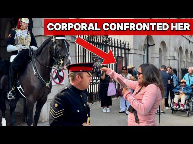 CORPORAL CONFRONTS A LADY WHO ANNOYS THE HORSE AND KING’S GUARD