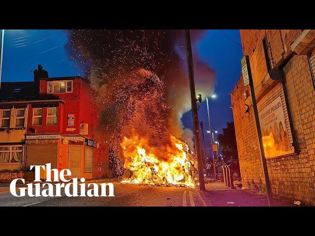 Police car turned over and vehicles set alight in Leeds unrest