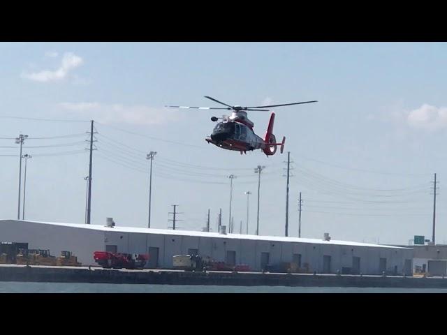 Coast Guard maneuvers over Charleston