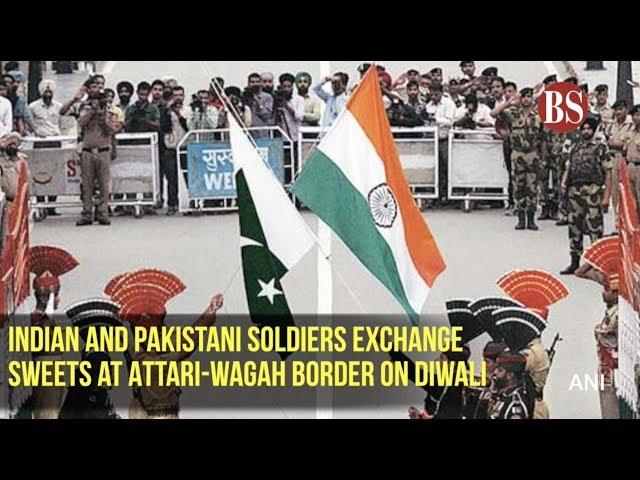 Indian and Pakistani soldiers exchange sweets at Attari-Wagah Border on Diwali